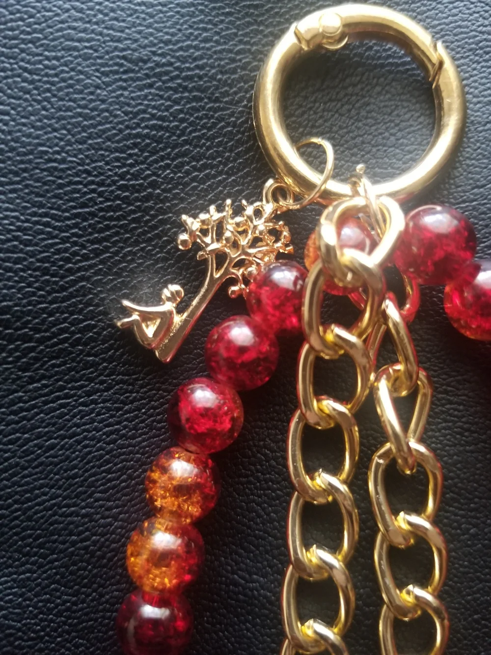 Gold Chain Bracelet Phone Charm with Red and Amber Faceted Beads